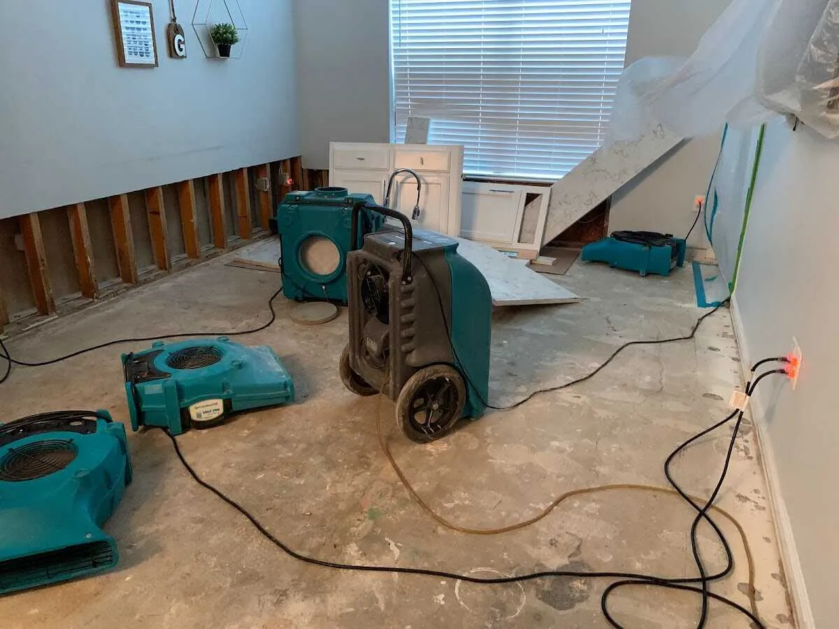 Dehumidifier in flood-cut room for Water Damage Restoration in College Park